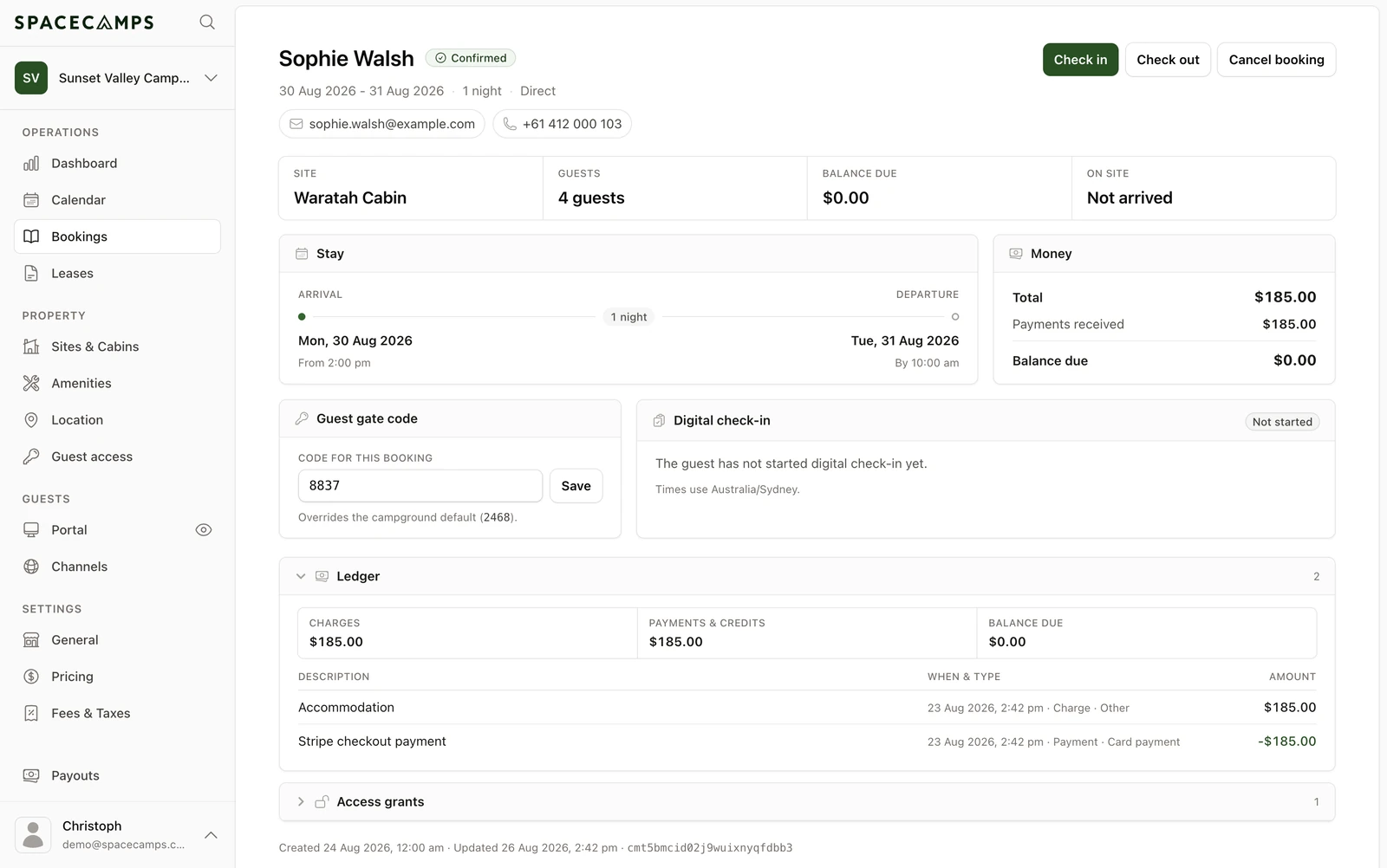 Spacecamps booking details showing guest stay, site, payments, and check-in status
